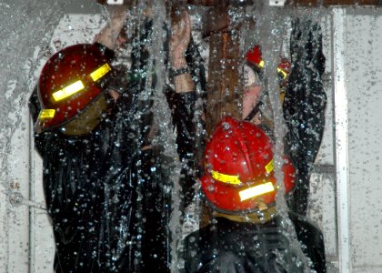 US Navy 051006-N-3019M-010 Sailors assigned to the guided missile frigate USS Reuben James (FFG 57), work together to control flooding during the Damage Control Olympics