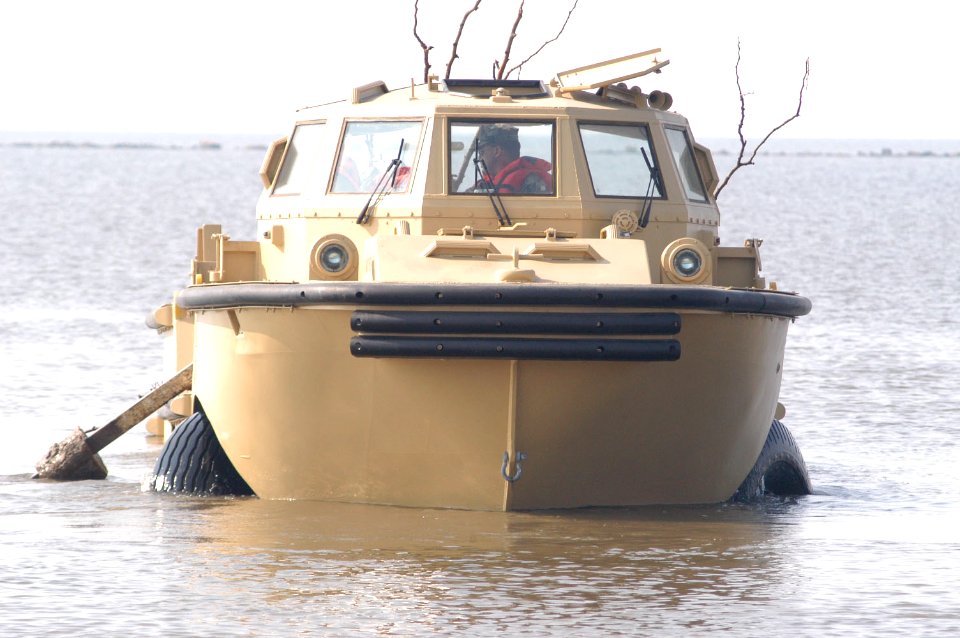 US Navy 050914-N-0793G-003 Beachmasters use a Logistical Amphibious Recovery Craft (LARC) amphibious vehicle assigned to Beachmaster Unit Two (BMU-2) to remove debris out of the water