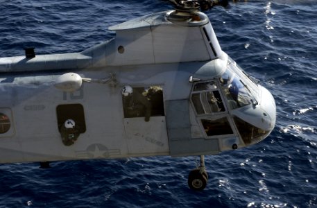 US Navy 050914-N-9866B-052 A U.S. Marine Corps CH-46E Sea Knight helicopter, assigned to Marine Medium Helicopter Squadron One Six Six (HMM-166), prepares to land on the flight deck of the amphibious assault ship USS Peleliu (L