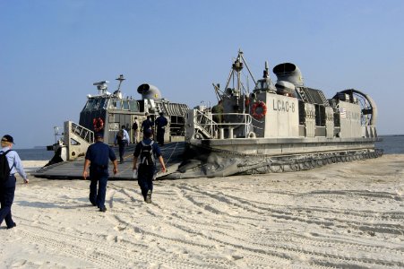 US Navy 050915-N-2636M-027 Several Sailors assigned to the amphibious assault ship USS Bataan (LHD 5), embark the Landing Craft, Air Cushion (LCAC) assigned to Assault Craft Unit Four (ACU-4) to return to the ship after providi photo