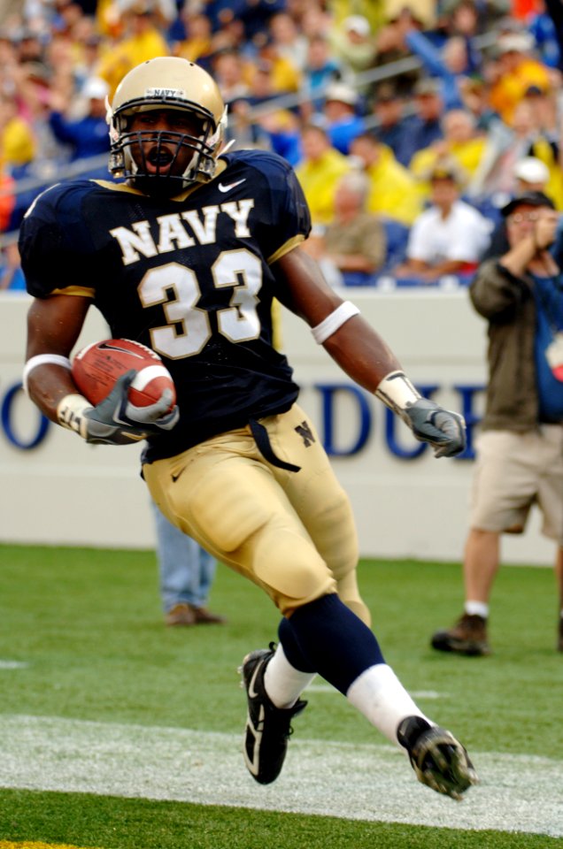 US Navy 051008-N-9693M-008 U.S. Naval Academy Midshipman slot back Karlos Whittaker crosses the goal line to score Navy's sole first half touchdown against the Air Force Falcons