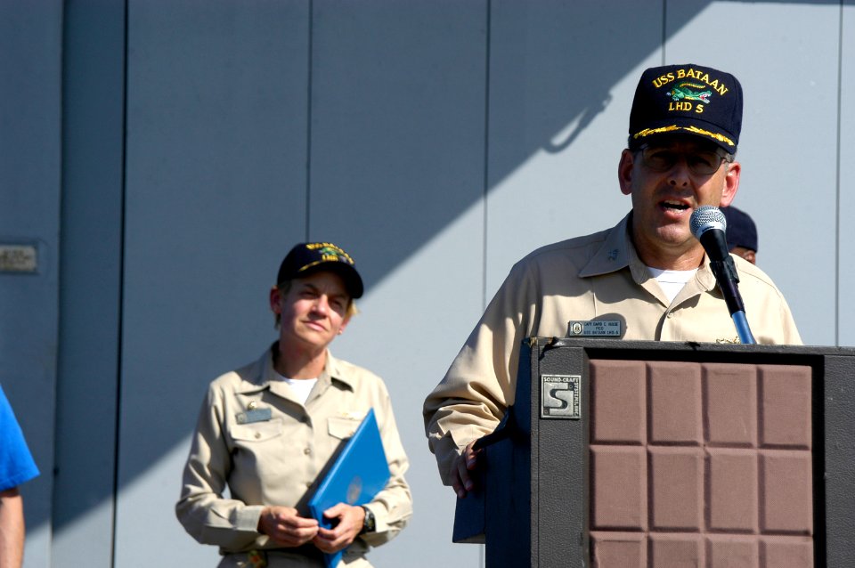 US Navy 050920-N-8154G-055 Capt. David C. Hulse speaks to the crew of the amphibious assault ship USS Bataan (LHD 5) during the ship's change of command ceremony