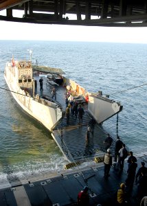 US Navy 050913-N-1467R-005 Sailors assigned to the amphibious assault ship USS Bataan (LHD 5) aboard a Landing Craft Utility (LCU) participate in a stern gate marriage evolution as part of the volunteer efforts
