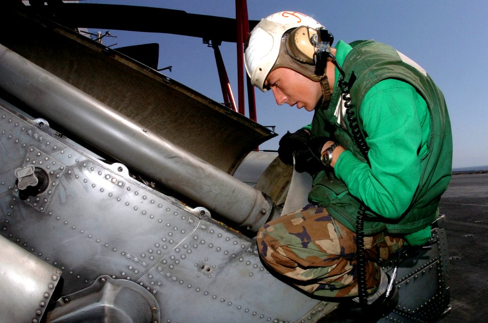 US Navy 050914-N-0413R-149 Aviation Structural Mechanic Airman Colby Stacy, assigned to the Indians of Helicopter Anti-Submarine Squadron Six (HS-6) completes the daily turn around inspection
