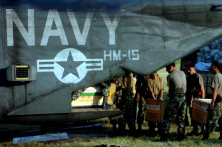 US Navy 051014-N-8796S-001 Pakistani soldiers load medical supplies onto a U.S. Navy MH-53E Sea Stallion helicopter in Chaklala, Pakistan