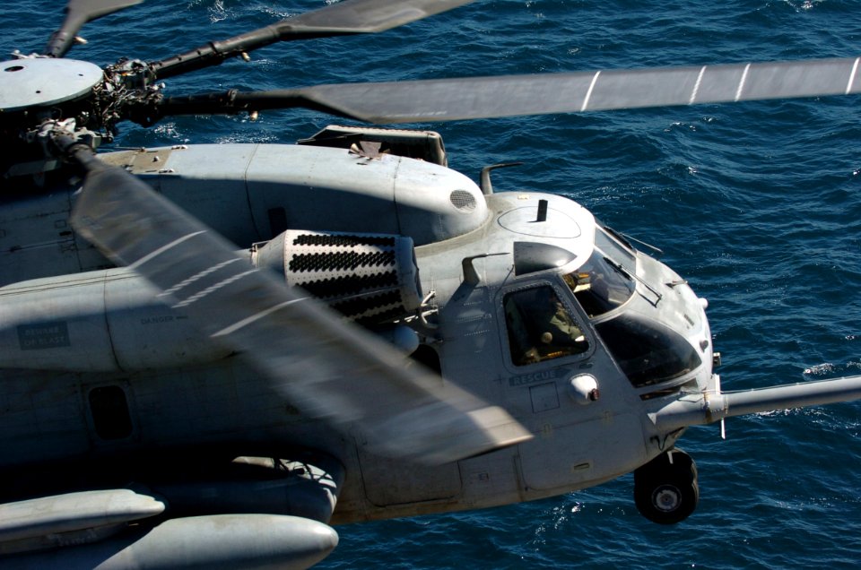 US Navy 050907-N-9866B-012 A U.S. Marine Corps CH-53E Super Stallion helicopter prepares to for landing aboard the amphibious assault ship USS Peleliu (LHA 5)