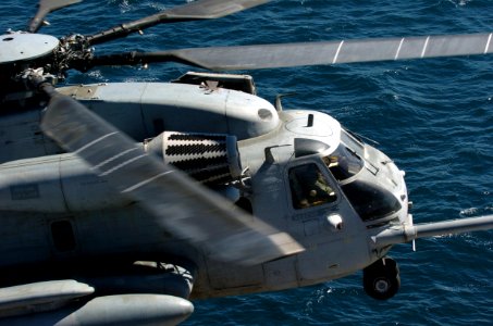 US Navy 050907-N-9866B-012 A U.S. Marine Corps CH-53E Super Stallion helicopter prepares to for landing aboard the amphibious assault ship USS Peleliu (LHA 5)