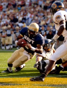 US Navy 051015-N-9693M-013 U.S. Naval Academy Midshipman Quarterback Lamar Owens rushes for a touchdown in the 4th quarter against the Kent State Golden Flashes