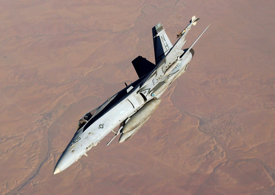 US Navy 050915-F-5480T-033 An F-A-18C Hornet banks away from a U.S. Air Force KC-10 Extender after conducting aerial refueling during a mission over the Persian Gulf region