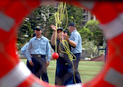 US Navy 051003-N-3019M-001 Boatswain's Mate 2nd Class Glenn Eglin, assigned to the guided missile destroyer USS Chung-Hoon (DDG 93), participates in a heaving line toss
