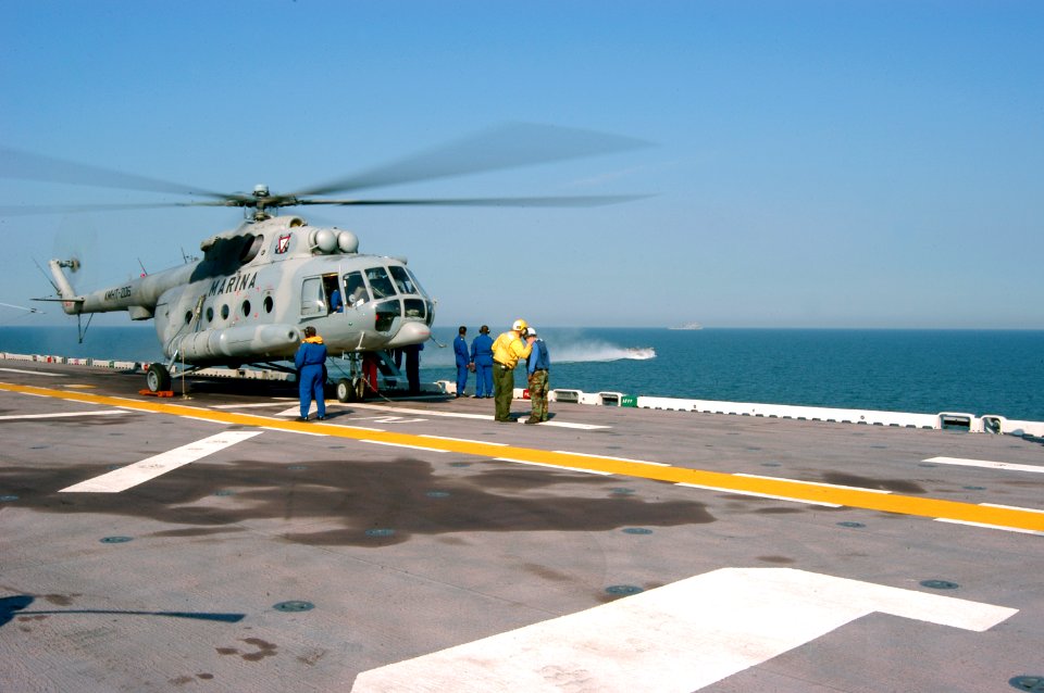 US Navy 050909-N-8154G-045 A Mexican Navy Mi-8 helicopter stands by for passengers on the flight deck aboard the amphibious assault ship USS Bataan (LHD 5), off the coast of Mississippi