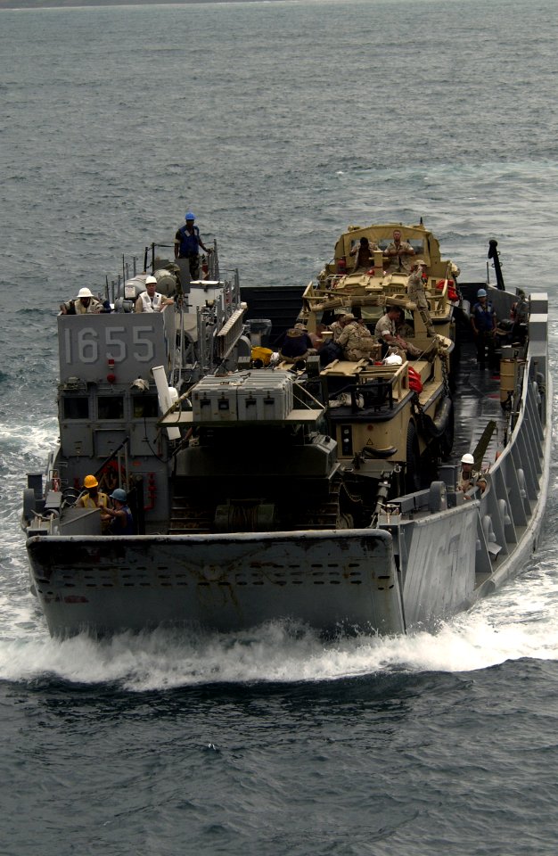 US Navy 051020-F-5789F-072 A U.S. Navy Landing Craft, Utility (LCU), assigned to the dock landing ship USS Gunston Hall (LSD 44), carries Landing Amphibious Recovery Crafts (LARC) and personnel back to the ship during the West