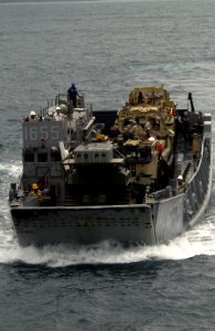 US Navy 051020-F-5789F-072 A U.S. Navy Landing Craft, Utility (LCU), assigned to the dock landing ship USS Gunston Hall (LSD 44), carries Landing Amphibious Recovery Crafts (LARC) and personnel back to the ship during the West