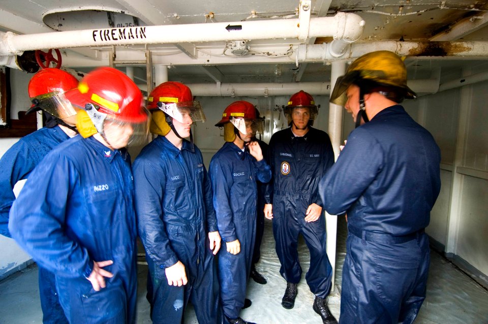 US Navy 051006-N-8157C-002 Students at the Center of Naval Engineering Learning Site Pearl Harbor, Firefighting and Damage Control schoolhouse, conduct various training drills
