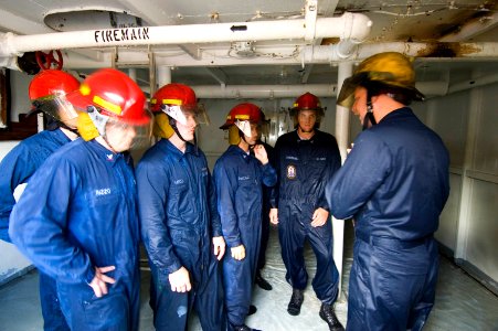 US Navy 051006-N-8157C-002 Students at the Center of Naval Engineering Learning Site Pearl Harbor, Firefighting and Damage Control schoolhouse, conduct various training drills