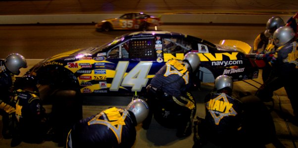 US Navy 050909-N-9769P-066 The pit crew of the No. 14 Navy Dodge Charger from the Navy-FitzBradshaw NASCAR Busch Series team make adjustments to the racecar