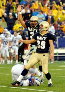 US Navy 051008-N-9693M-019 U.S. Naval Academy Midshipmen kicker Joey Bullen celebrates his game winning field goal with 4-10ths of a second left in the game against Air Force as Falcon defender Carson Bird (2) rolls out of the