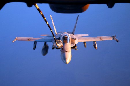 US Navy 050913-F-5480T-039 An F-A-18C Hornet refuels from a U.S. Air Force KC-10 Extender aerial tanker photo