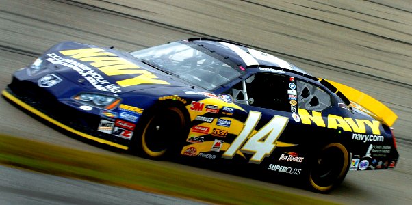 US Navy 051022-N-9769P-298 Accelerating through turn number three during the Sam's Town 250 race at Memphis Motor Sports Speedway