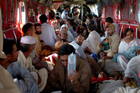 US Navy 051012-N-8796S-296 Injured Pakistani civilians sit in the cabin of a U.S. Army CH-47 Chinook helicopter during a transport flight to the Pakistan Air Force base in Chaklala, Pakistan for medical treatment photo