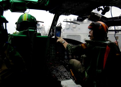 US Navy 051022-N-4374S-001 Spanish pilots of an AB 212 helicopter, assigned to the Spanish oiler SPS Marques De La Ensenada (A 11), prepare to launch from the flight deck of the guided missile destroyer USS Ross (DDG 71)