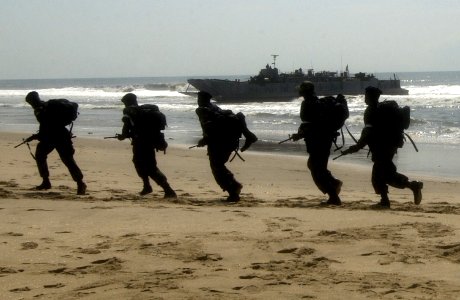 US Navy 051015-F-5789F-040 Ghanaian soldiers run to their positions while engaged in amphibious operations in southwest Ghana during the West African Training Cruise '06 (WATC)