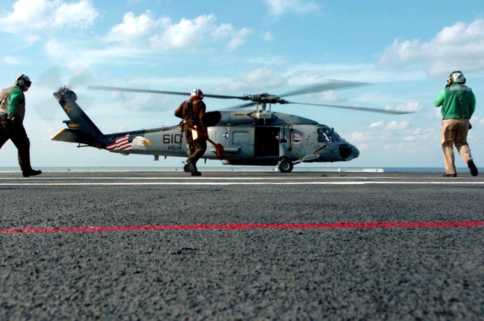 US Navy 051025-N-3488C-028 A SH-60F Seahawk helicopter, assigned to the Chargers of Helicopter Anti-Submarine Squadron Fourteen (HS-14), lands during carrier qualifications