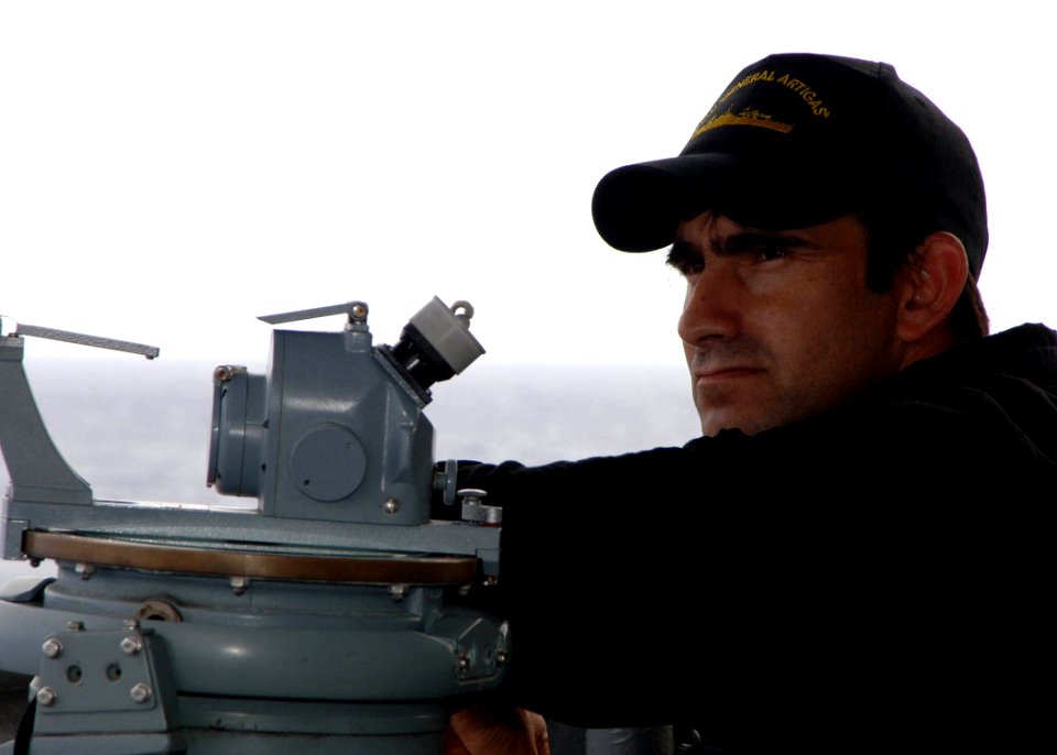 US Navy 051025-N-4374S-002 A Uruguayan Navy Sailor, assigned to frigate ROU General Artigas (ROU 2), monitors the sea traffic off the coast of Brazil during UNITAS 47-06