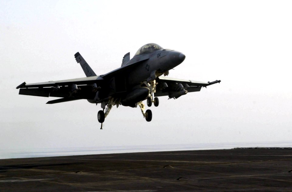 US Navy 050920-N-0361G-062 An F-A-18F Super Hornet prepares to make an arrested landing on the flight deck aboard the nuclear-powered aircraft carrier USS Nimitz (CVN 68)