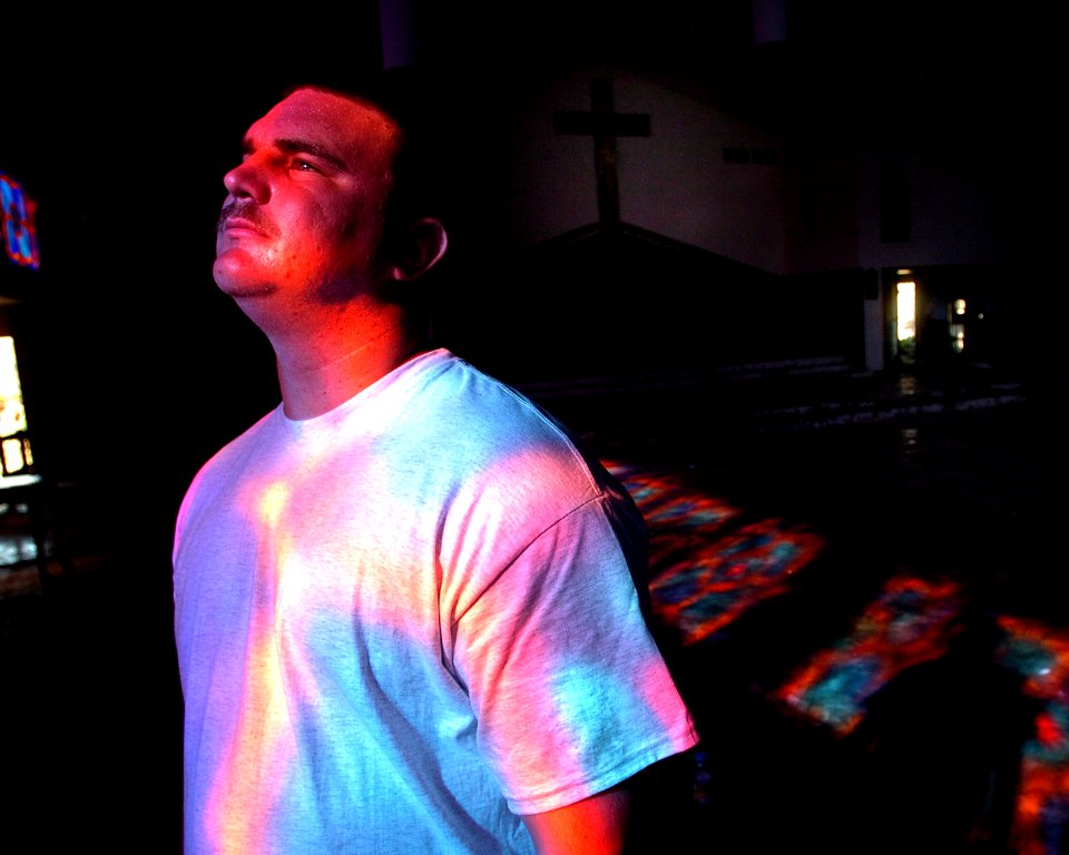 US Navy 051020-N-3729H-093 U.S. Navy Airman Eric Labrecque, assigned to the Nimitz-class aircraft carrier USS John C. Stennis (CVN 74), enters a church in Slidelle, La., during cleanup efforts