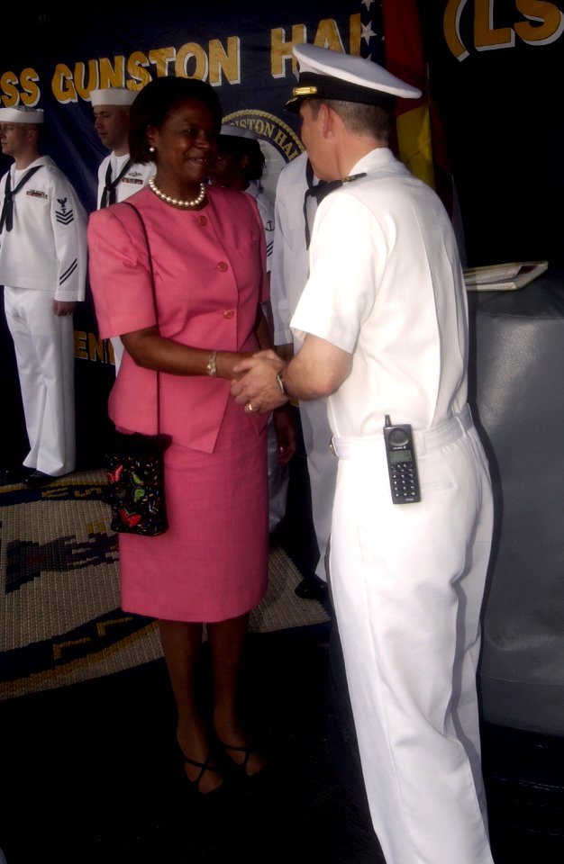 US Navy 051021-F-5789F-016 Commanding Officer, USS Gunston Hall (LSD 44), Cmdr. Thomas M. Negus, welcomes aboard the U.S. Ambassador to the Republic of Ghana, the Honorable Pamela E. Bridgewater, while the ship is at port in Ta