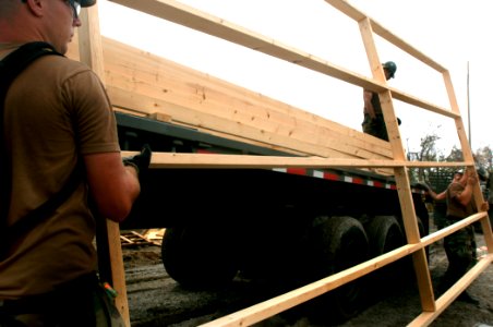 US Navy 050924-N-2653P-052 U.S. Navy Seabees, assigned to Naval Mobile Construction Battalion Four (NMCB-4), help assemble the foundation for the first of 75 temporary housing shelters in Pass Christian, Miss