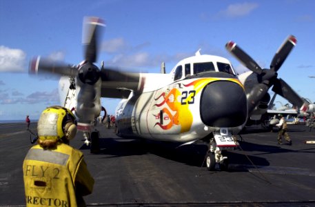 US Navy 051021-N-0361G-009 Aviation Boatswain's Mate 3rd Class Jessica Doche directs a C-2A Greyhound