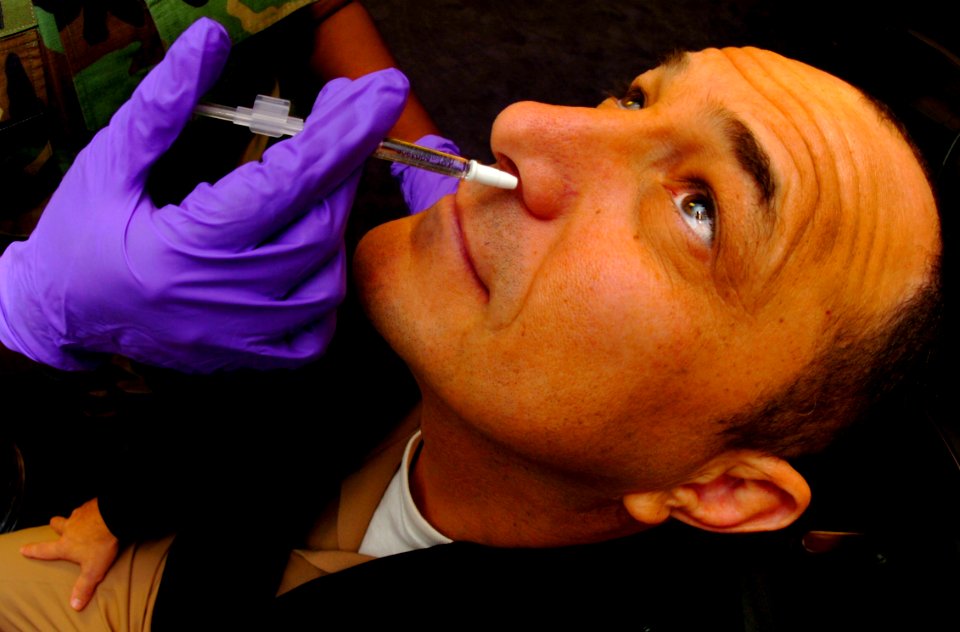 US Navy 051028-N-9769P-002 Senior Chief Navy Counselor David Paradise, assigned to Commander Naval Recruiting Command, receives his annual Influenza vaccine in the form of a nasal mist