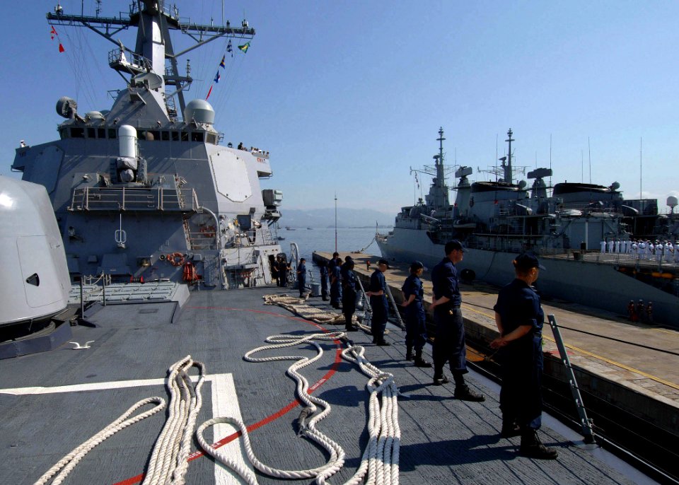 US Navy 051021-N-4374S-004 Sailors aboard the guided missile destroyer USS Ross (DDG 71) man the rails as they depart Naval Base Do Rio de Janeiro, Brazil