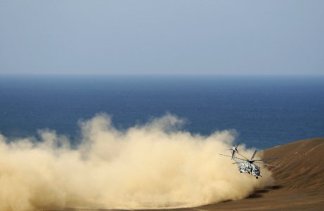 US Navy 050927-F-7234P-111 A Marine Corps CH-53 Sea Stallion helicopter kicks up sand as it makes its way along the Gulf of Tadjoura, Djibouti