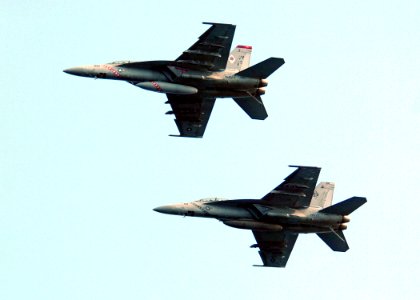 US Navy 051025-N-3488C-061 Two F-A-18F Super Hornets, assigned to the Diamondbacks of Strike Fighter Squadron One Zero Two (VFA-102), prepare to enter the break