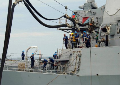 US Navy 051022-N-4374S-006 Sailors assigned to the guided missile destroyer USS Ross (DDG 71) conduct a replenishment at sea with the Spanish oiler