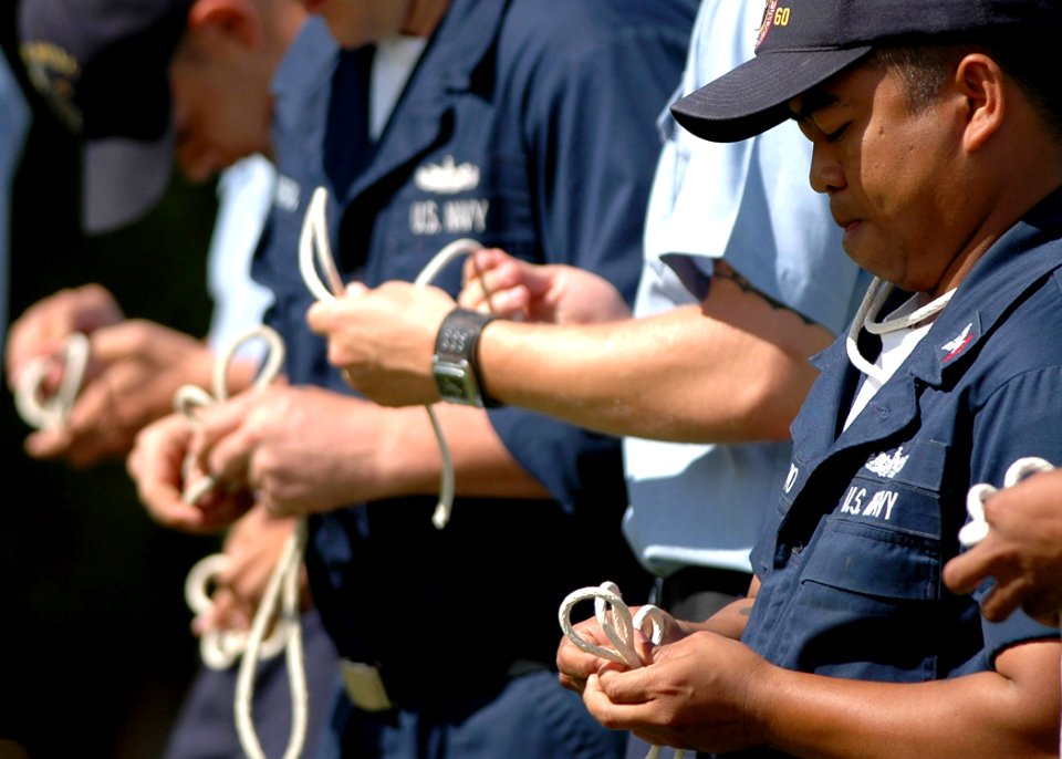 US Navy 051003-N-3019M-003 A Sailor assigned to the guided missile destroyer USS Paul Hamilton (DDG 60), participates in a knot tying competition as part of Surface Line Week at Pearl Harbor