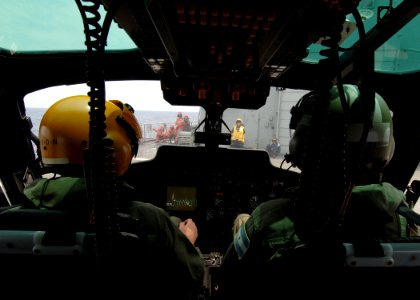 US Navy 051023-N-4374S-001 Pilots of an Argentinean AS 555 Fennec helicopter make final preparations prior to launch from the flight deck of the Spanish oilier SPS Marques De Le Ensenada (A 11)