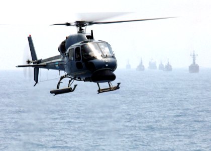 US Navy 051026-N-4374S-003 An Argentinean AS 555 Fennec helicopter approaches the flight deck of the guided missile destroyer USS Ross (DDG 71)