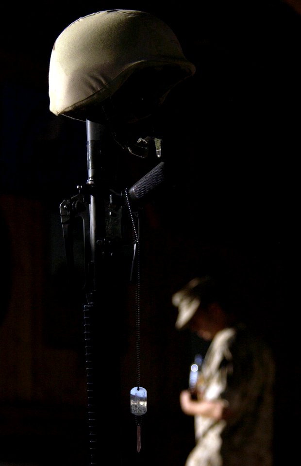 US Navy 051023-F-7234P-130 U.S. Navy Builder 3rd Class Fabricio Moreno's rifle, Kevlar, boots and dog tags are assembled in accordance to military tradition during a memorial ceremony