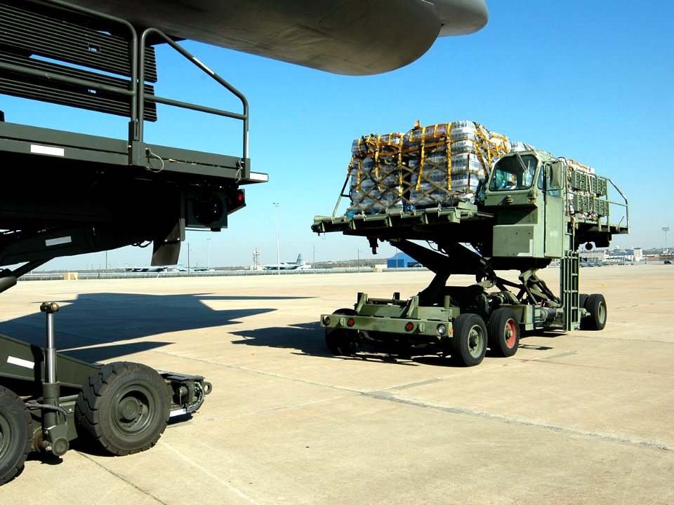 US Navy 051028-N-1328C-536 Food and water supplies for victims of Hurricane Wilma are loaded aboard a U.S. Air Force C-5 Galaxy cargo plane on board Naval Air Station Joint Reserve Base