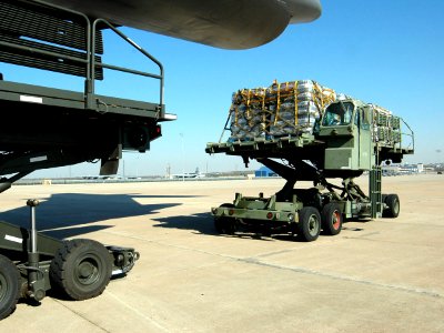 US Navy 051028-N-1328C-536 Food and water supplies for victims of Hurricane Wilma are loaded aboard a U.S. Air Force C-5 Galaxy cargo plane on board Naval Air Station Joint Reserve Base
