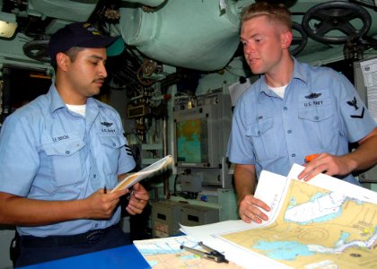 US Navy 051011-N-0879R-001 Sailors aboard the Los Angeles-class fast attack submarine USS Tucson (SSN 770) make final preparations before getting underway photo