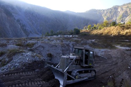 US Navy 051113-F-2729L-020 A U.S. Navy Seabee assigned to Naval Mobile Construction Battalion Seven Four (NMCB-74), levels the ground in Muzaffarabad, Pakistan using a bulldozer