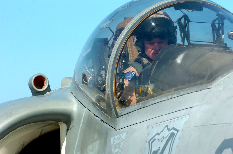 US Navy 051114-N-9866B-152 An AV-8B Harrier pilot conducts an instrument check prior to launching from the flight deck of the amphibious assault ship USS Peleliu (LHA 5)