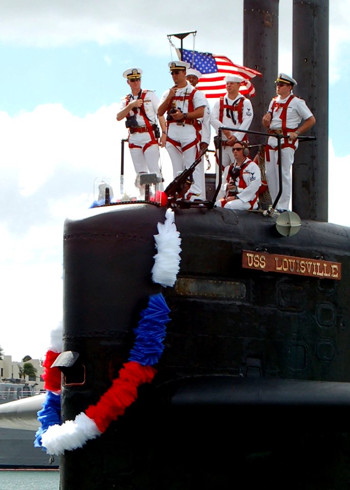US Navy 051116-N-0879R-002 Crew members aboard the Los Angeles-class fast attack submarine USS Louisville (SSN 724) man the submarine's sail as they return to Naval Station Pearl Harbor, Hawaii