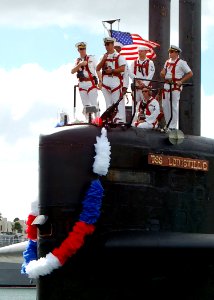 US Navy 051116-N-0879R-002 Crew members aboard the Los Angeles-class fast attack submarine USS Louisville (SSN 724) man the submarine's sail as they return to Naval Station Pearl Harbor, Hawaii photo