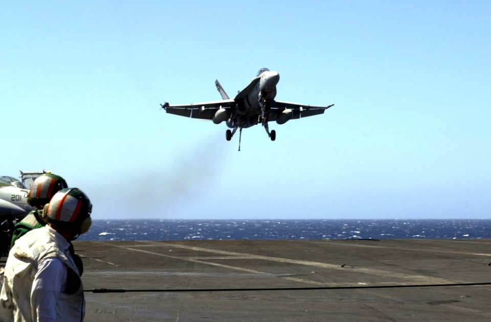 US Navy 051013-N-0361G-022 An F-A-18C Hornet, assigned to the Mighty Shrikes of Strike Fighter Squadron Nine Four (VFA-94), prepares to land on the flight deck aboard the nuclear-powered aircraft carrier USS Nimit